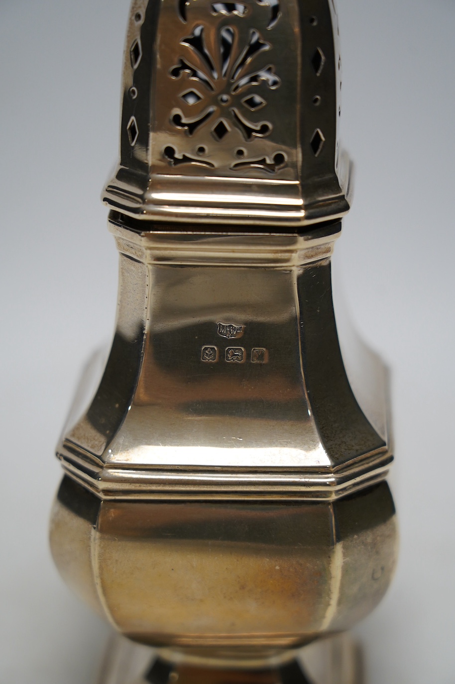 A George V silver octagonal sugar caster, by Mappin & Webb, Birmingham, 1923, 18.5cm, 7.2oz. Condition - fair to good